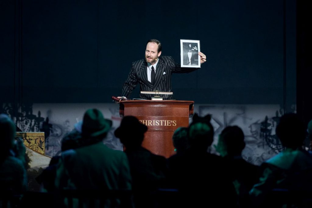 1. O.L.Biron (Christie’s auctioneer) and ensemble, “Nureyev” by Y.Possokhov and K.Serebrennikov, State Ballet Berlin 2026 © C.Quezada 