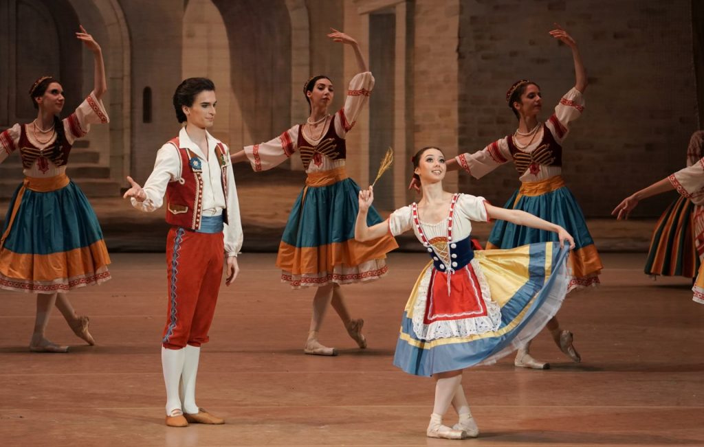 2. D.Zakharov (Frantz), E.Kokoreva (Swanilda), and ensemble; “Coppélia” by S.Vikharev after M.Petipa and E.Cecchetti, Bolshoi Ballet 2026 © Bolshoi Theatre/P.Rychkov